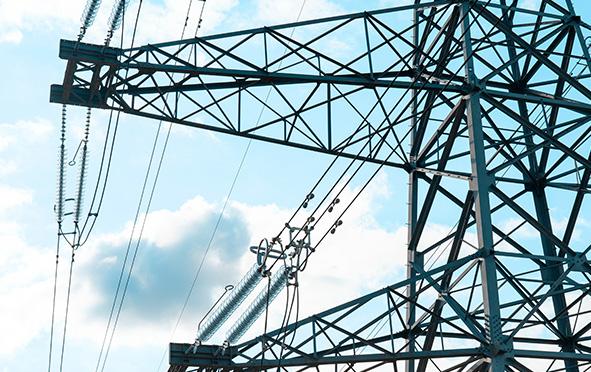 Power Transmission Tower Against A Blue Sky